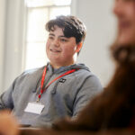 A business student sat in front of a laptop