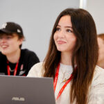 Business students sat in front of laptops