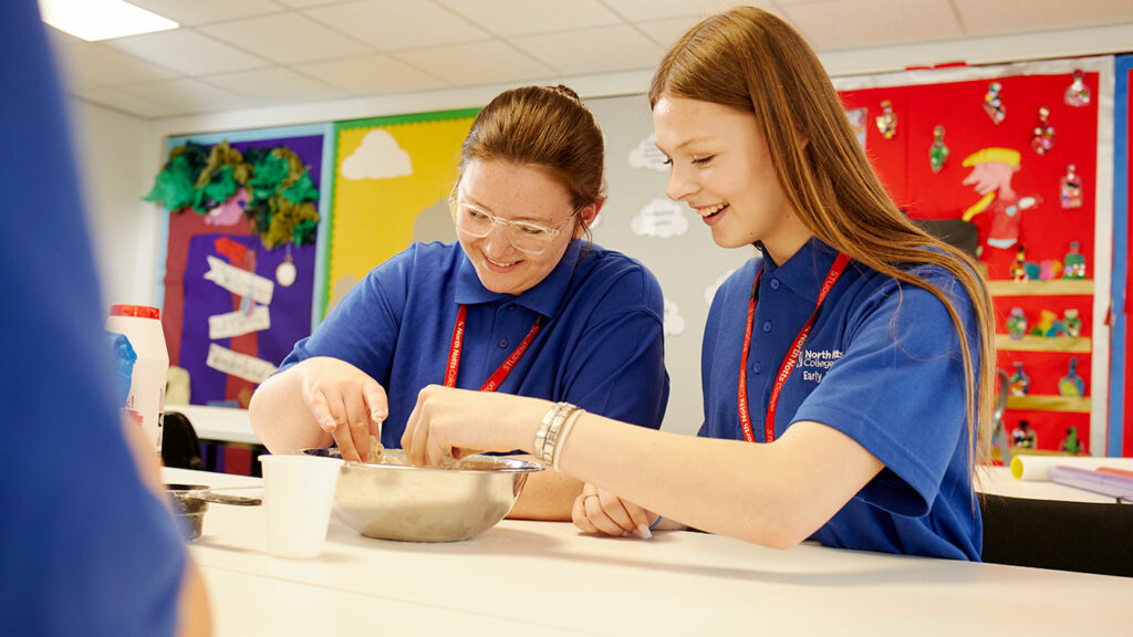 Two students sat at a table