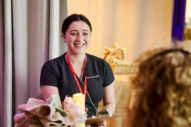 A student smiling at a client