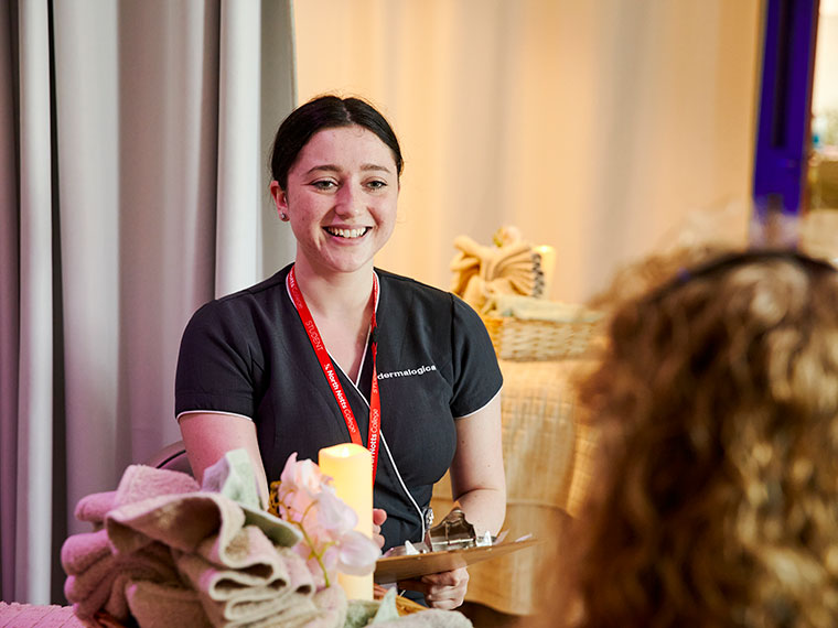 A student smiling at a client
