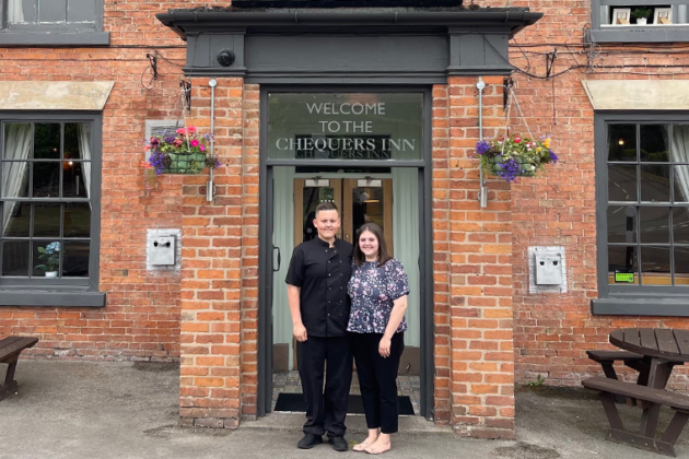 Connor and Jade former Hospitality Apprentices standing infront of a pub