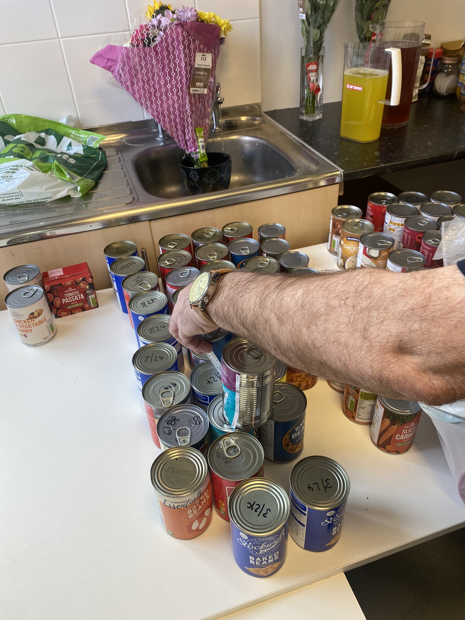 sorting tins of food