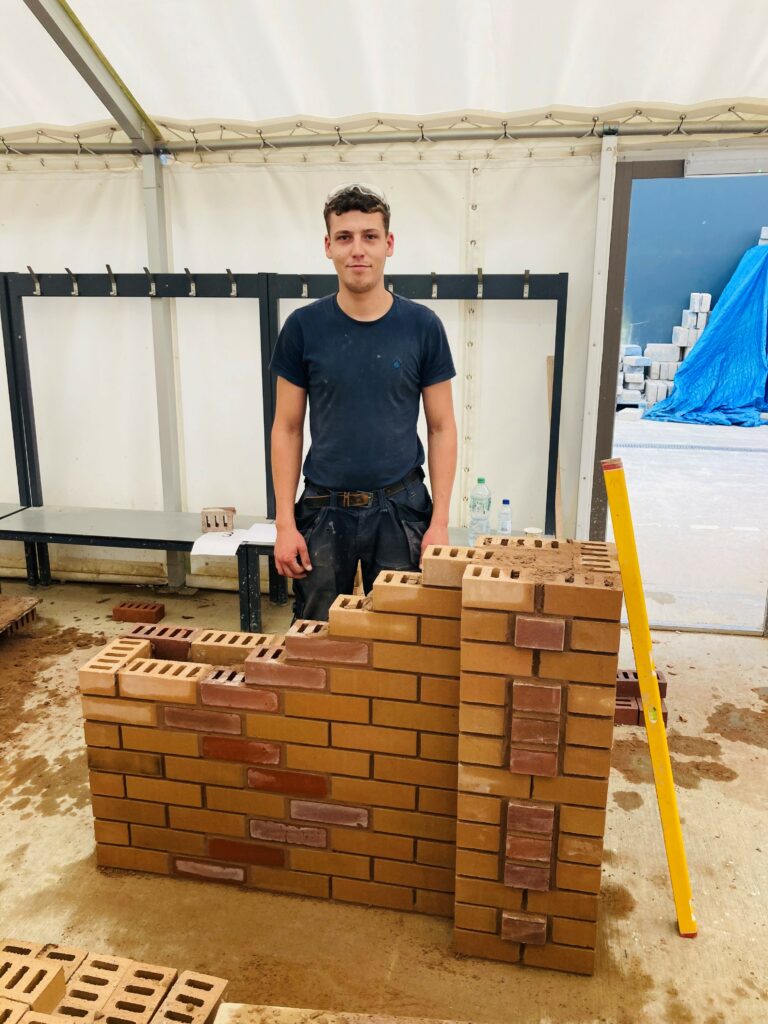Christopher with his winning brickwork entry