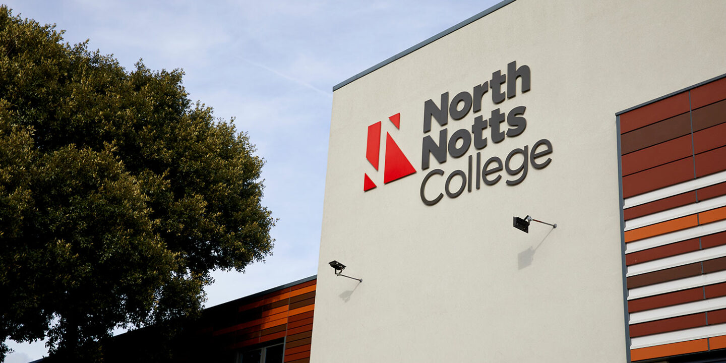 Close up of NNC signage on the outside of the building