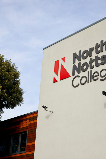 Close up of NNC signage on the outside of the building