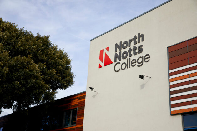 Close up of NNC signage on the outside of the building