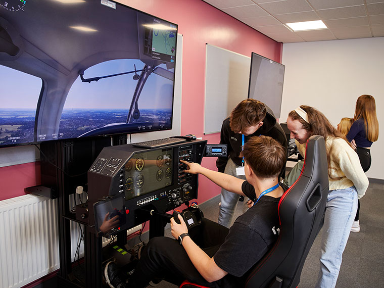 An aviation student using the flight simulator