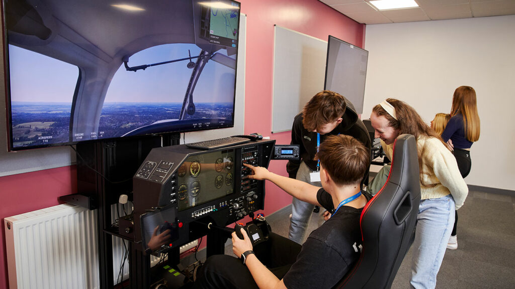 An aviation student using the flight simulator