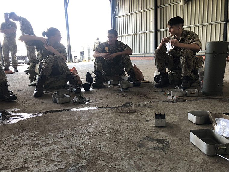 Protective Services students wearing army clothing sat together