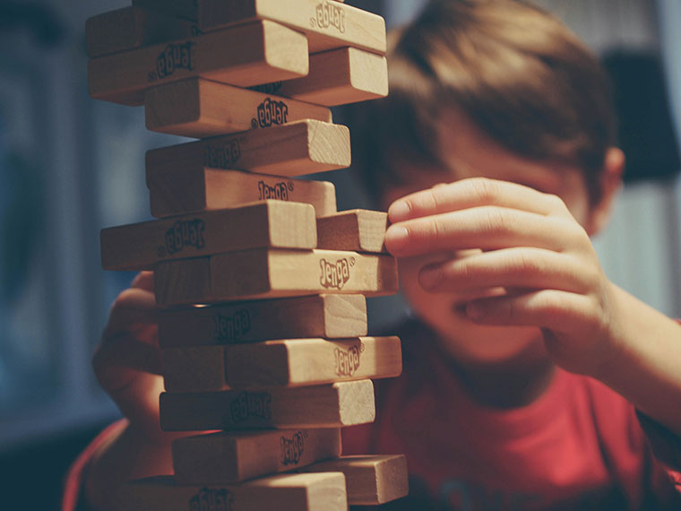 Someone playing Jenga
