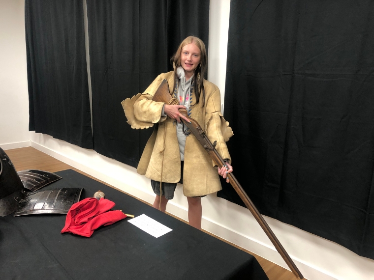 student holding musket