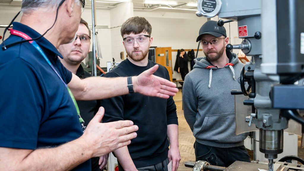 Engineering students listening to their tutor