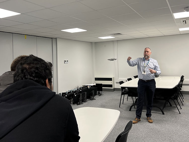 Students being shown how to use the drone