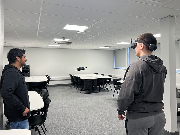 Students having a go on the drone