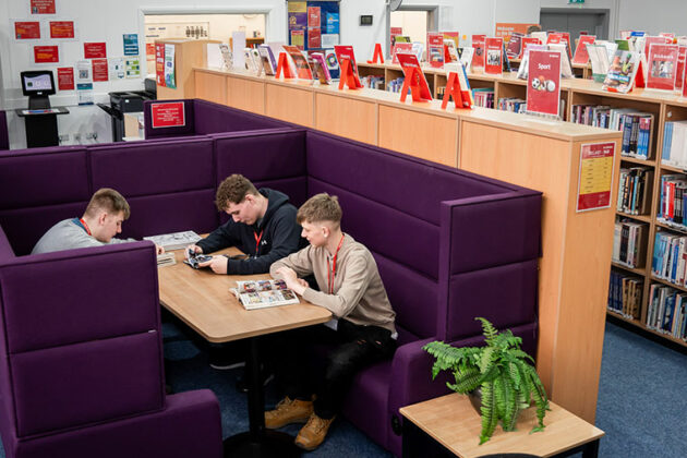 Students sat at a table in the NNC library