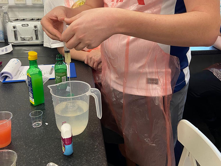 Students taking part in a hydration science experiment