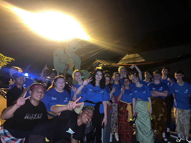 A group of students at night time enjoying the Ogoh-Ogoh parade
