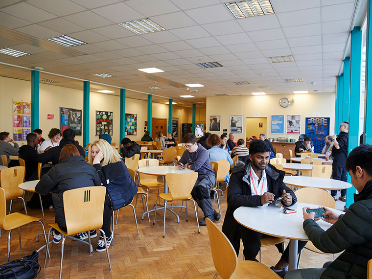 People sat at tables in the bistro at North Notts College