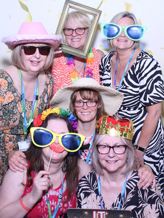 Staff in the photo booth at the student celebration event 2024