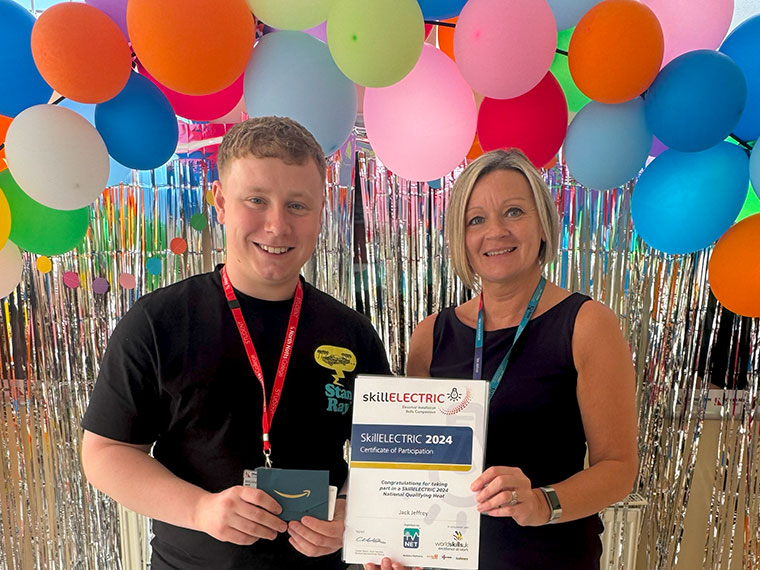 A student receiving an award at the end of year student celebration event 2024