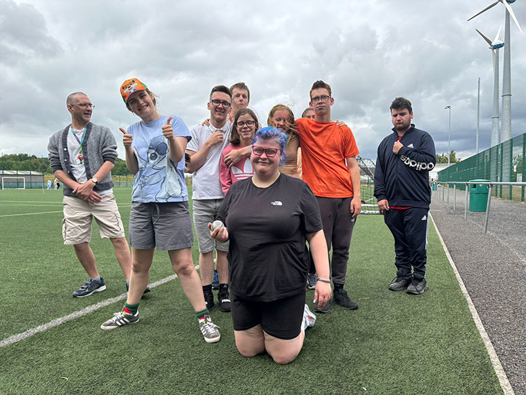 Flex students sat on the grass during their sports day