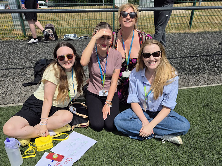 Flex students sat on the grass during their sports day