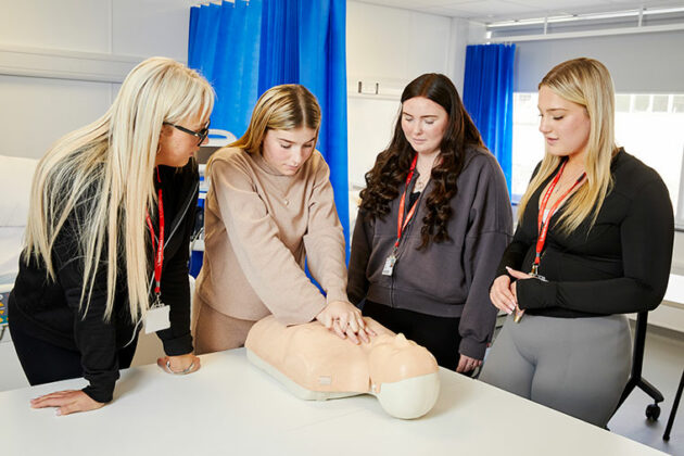 Students in the North Notts College health suite learning CPR