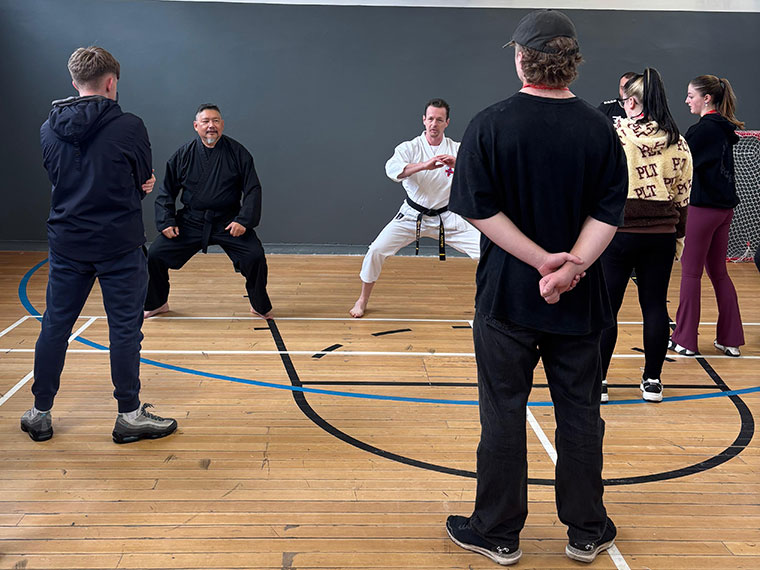 Practicing karate in the sports hall