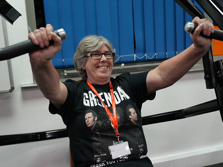 Lynn using some exercise equipment in the gym