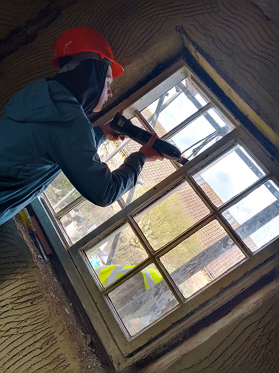 A student working on a window
