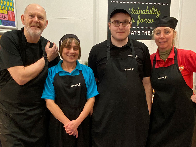 Supported Intern Jakob stood with three members of Aramark