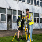 Construction students outside a building