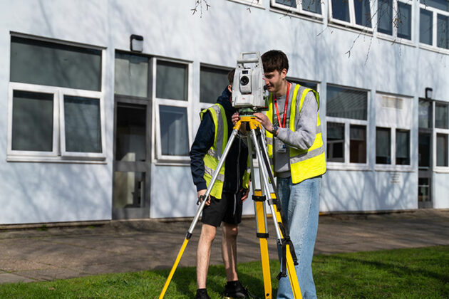 Construction students outside a building