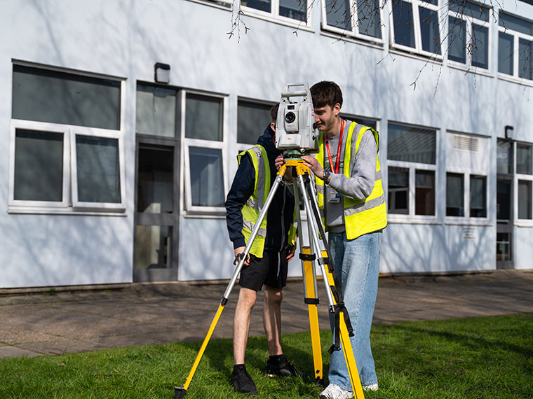 Construction students outside a building