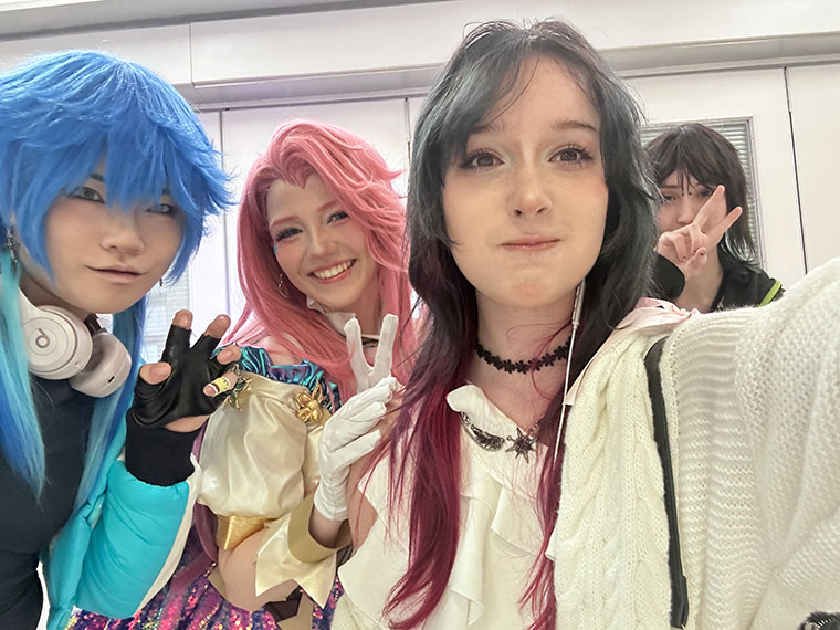 Four students taking a self of themselves