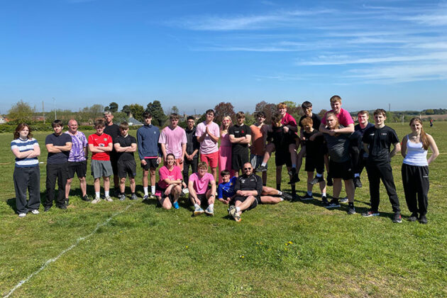 A group photo of students outside on their sports day