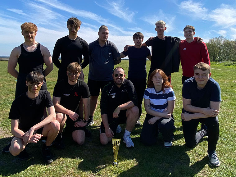 A group photo of students outside on the grass