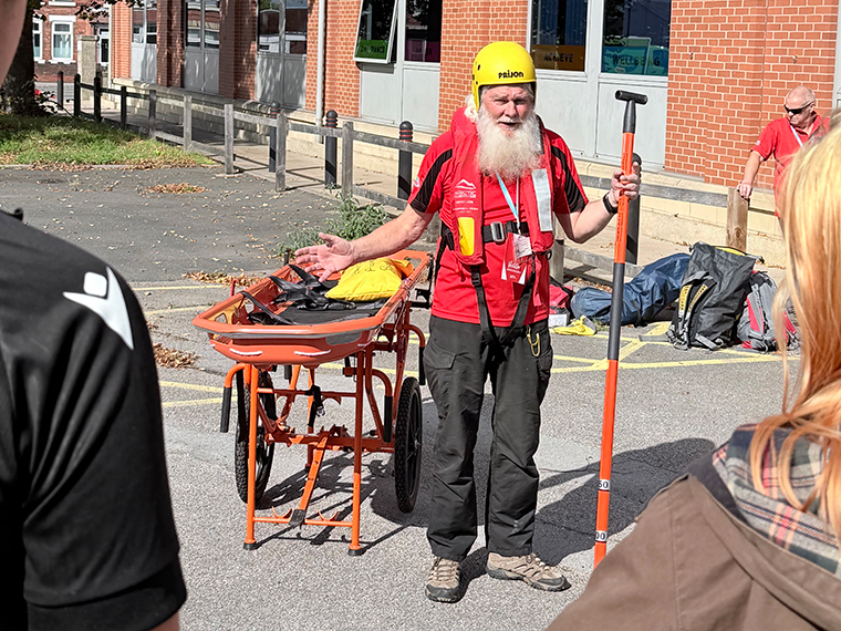 A man from Nottinghamshire Search and Rescue demonstrating rescue wear and equipment